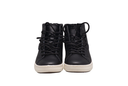 Black athletic shoes on a white sole. Isolated on white.の写真素材