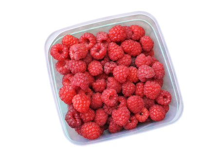 Raspberries in a container. View from above. Close-up.