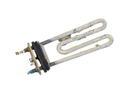 Faulty heater from the washing machine. Spoiled detail. Isolated on white.の写真素材