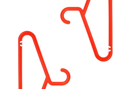 Clothes hangers. Parts from different sides of the frame. Isolated on white.の写真素材