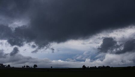 Dark clouds blue sky silhouetteの写真素材