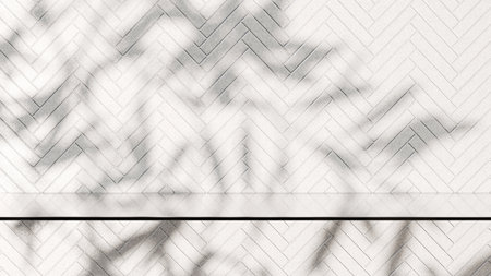White herringbone wall with a thin shelf and blurred botanical leaf shadows creating a soft, dreamy,...