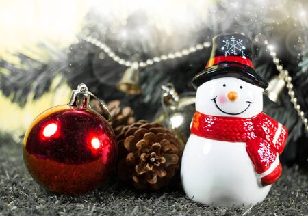 hristmas Decoration and Ornaments- Snow Man on Christmas Tree background with Selective Focus in Vintage Colorの写真素材