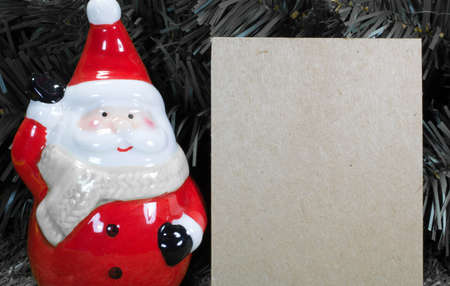 Christmas Decoration and Ornaments- Santa Claus with A Blank Note with Selective Focusの写真素材