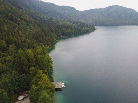 Amazing landscape of alpine lake with crystal clear green water and blue sky.の写真素材