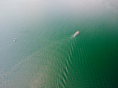 Aerial view of a speed boat sailing in the sea.の写真素材