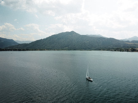 Sailboat sailing on crystal turquoise watersの写真素材
