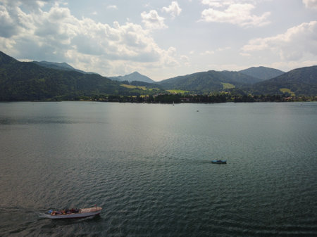 Panoramic view of deep blue Lake Lugano in Switzerland surrounded by mountains