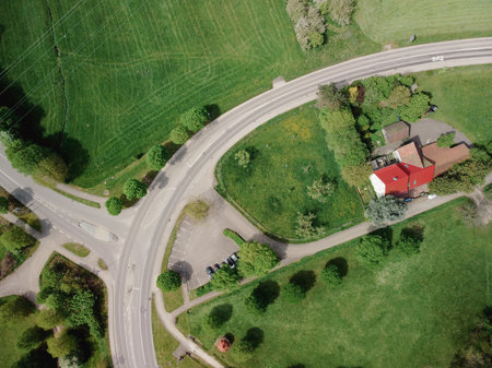 The roundabout road aerial view that newly developed. Summer sunny day. Roundabout on suburban road.の写真素材