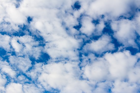 Beautiful blue clouds on a dark blue skyの写真素材