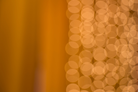 beautiful golden bokeh on a light backgroundの写真素材