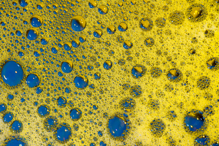 blue and gold background with air bubbles abstract textureの写真素材