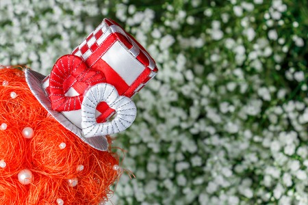 A hat with a red and white heart on a light backgroundの写真素材