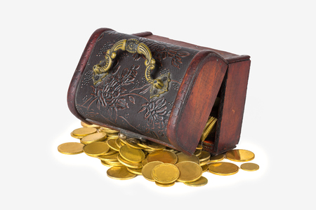 Pirate chest with scattered golden coins on a white background isolateの写真素材