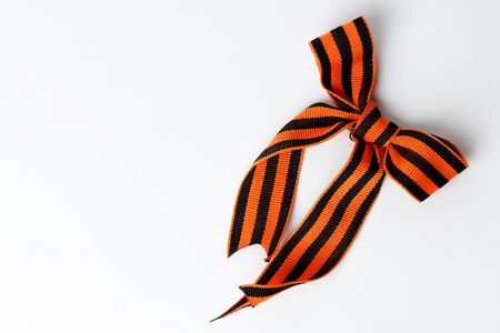 Bant of black and orange ribbons of St. George isolated on white backgroundの写真素材