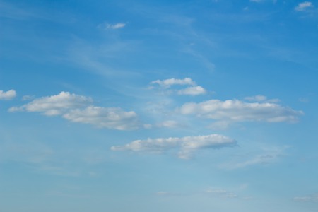 Light snowy white fluffy Clouds on a background of a gentle blue skyの写真素材