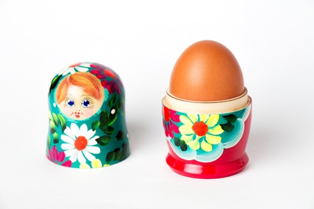 Matryoshka inside which lies a chicken eggの写真素材