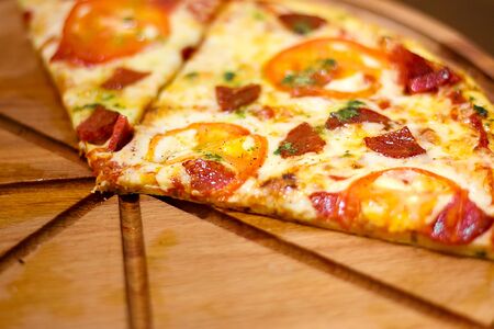 Close-up of freshly baked pizza top viewの写真素材