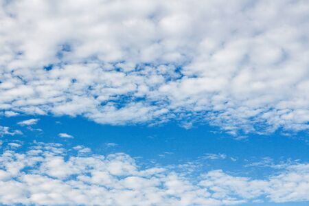 Beautiful blue sky with creeping white cloudsの写真素材