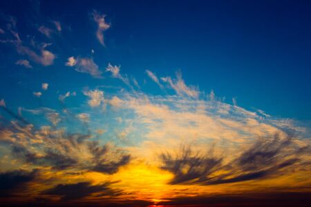Colorful and beautiful sunset over an industrial cityの写真素材
