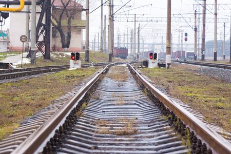 Railway station in the industrial zone rails go into the distanceの写真素材