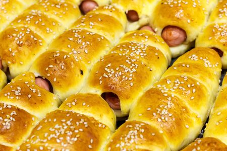 Fresh tasty sausages in dough close upの写真素材