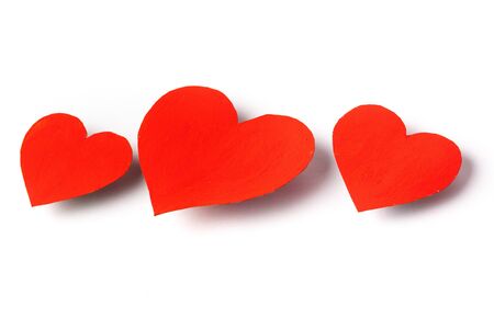 Red hearts lie on a white background as a background.の写真素材