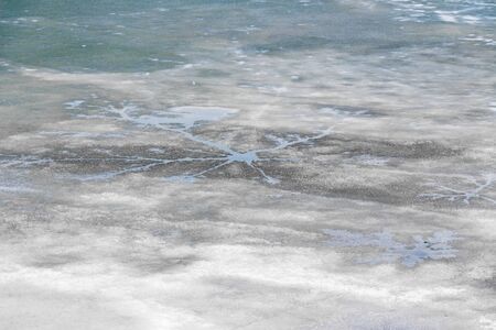Melting thin ice in the pond.