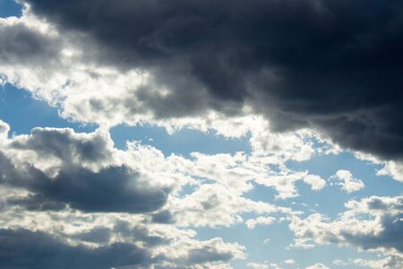 Blue sky background with cloudsの写真素材