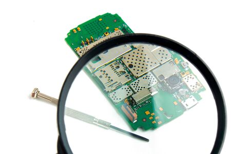 printed circuit board under a magnifying glassの写真素材