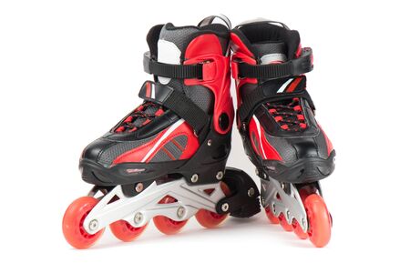 Black and red skating rollers on a white background.の写真素材