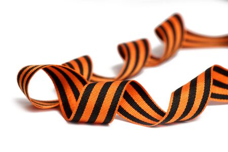 Orange-black St. George ribbon on a white backgroundの写真素材