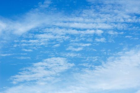Beautiful white clouds against the blue skyの写真素材