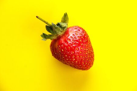 strawberries on a yellow backgroundの写真素材