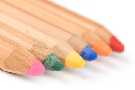 coloured pencils with shadow on white backgroundの写真素材