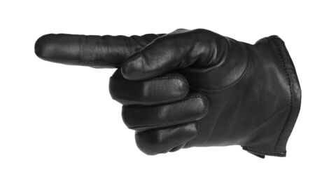 a black glove pointing, isolated on whiteの写真素材