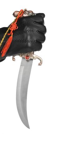 Hand in glove with dagger, isolated on white