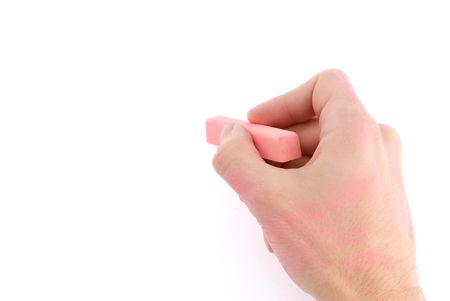 Hand with pink chalk writing on a white background