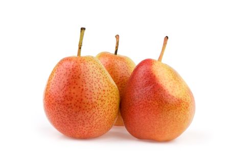 three fresh yellow pears isolated on whiteの写真素材