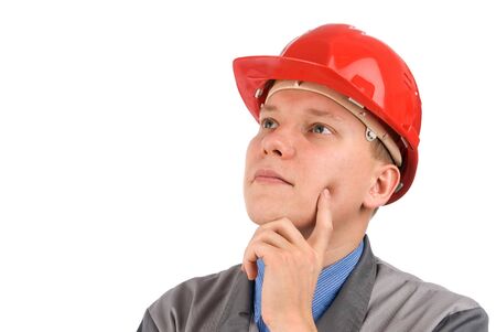 Portrait of a construction worker thinking in a hardhatの写真素材