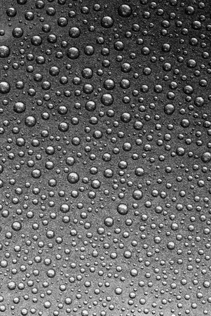 Rain droplets on a grey steelの写真素材