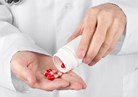 Closeup on man's hands with pillsの写真素材
