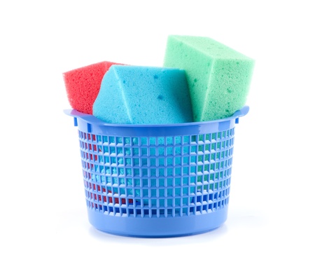 Plastic bucket with sponges isolated on whiteの写真素材