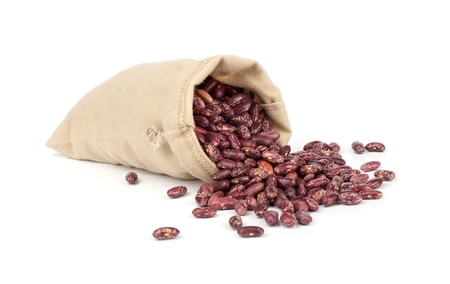 dried red beans in canvas sack on white background