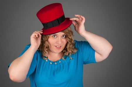 smiling fat woman on gray backgroundの写真素材