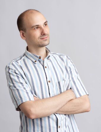 Young man looking away isolated on white backgroundの写真素材