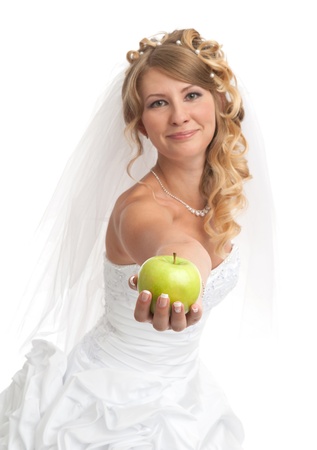 Smiled beauty bride with green appleの写真素材