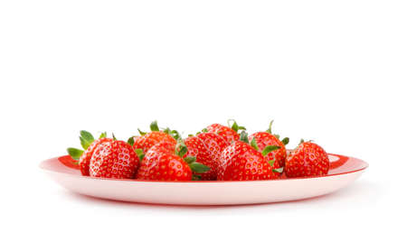 Strawberries on a plate isolated over white backgroundの写真素材