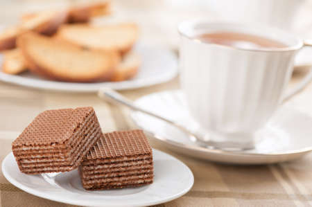 waffles and cup of tea on a tableの写真素材