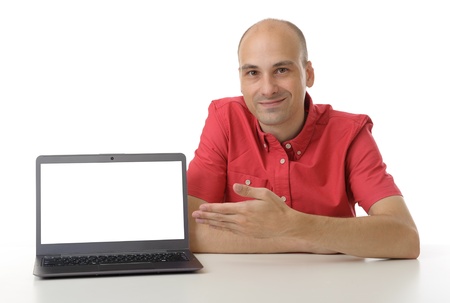man sitting at a desk with a laptopの写真素材